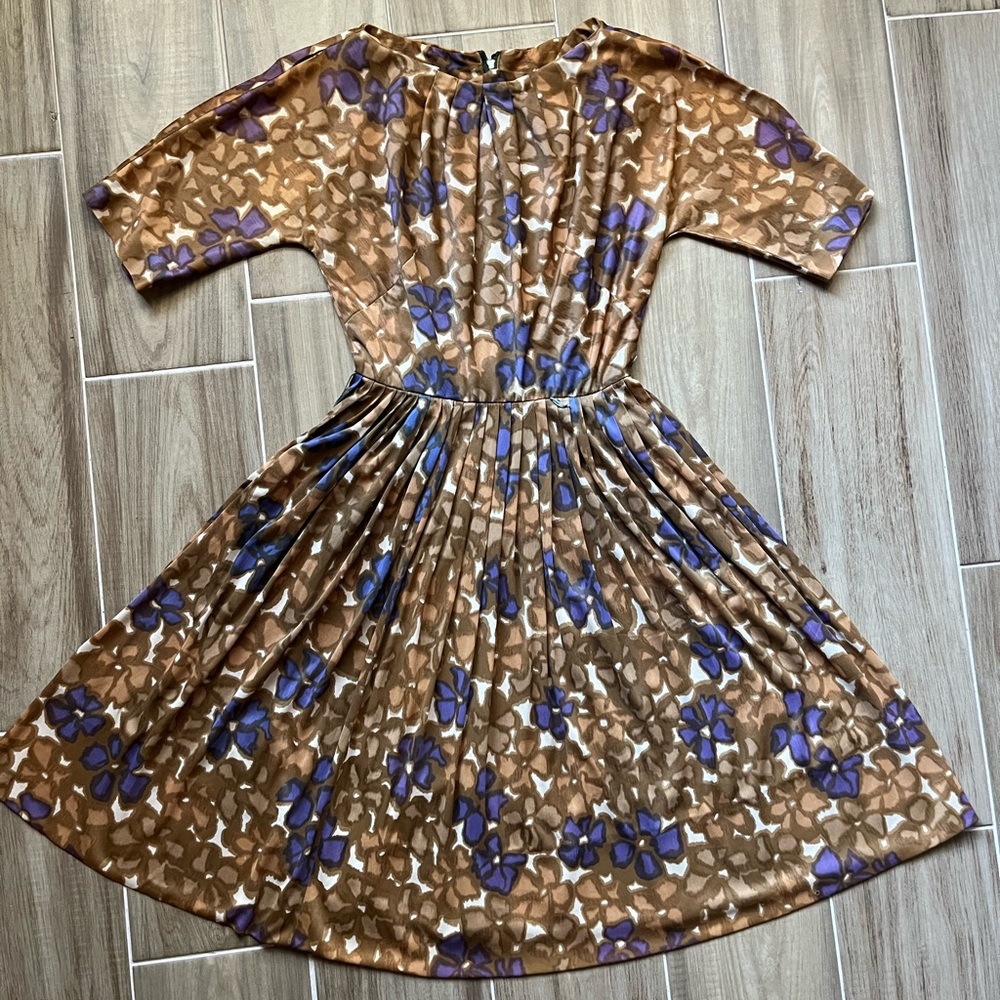 True vintage 1950s rayon jersey full skirt dress. With brown and purple floral